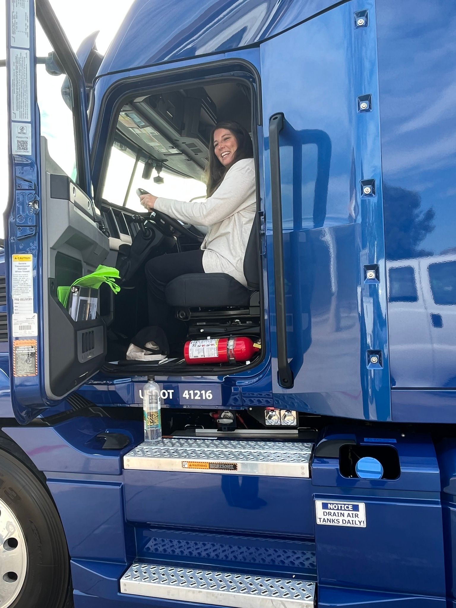 Katy Hiatt in semi truck driver's seat